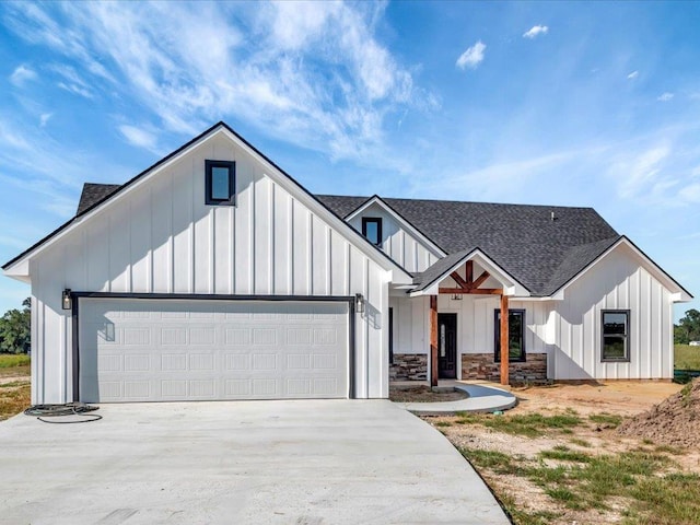 modern farmhouse style home featuring a garage