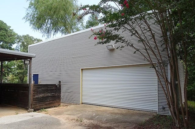 view of side of home with a garage