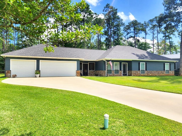 ranch-style house featuring a garage and a front lawn