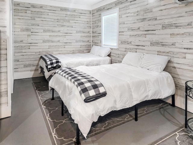 bedroom featuring finished concrete floors