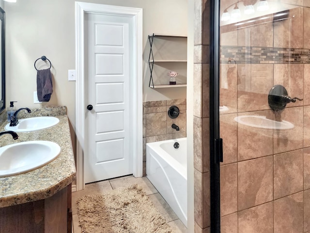 bathroom featuring tile patterned floors, a stall shower, a washtub, and a sink