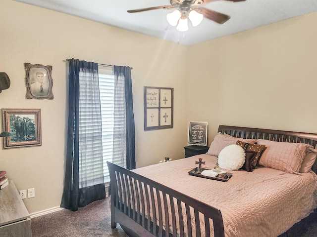 bedroom featuring baseboards, multiple windows, carpet, and a ceiling fan