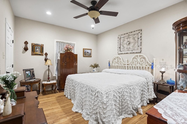 bedroom featuring hardwood / wood-style flooring and ceiling fan