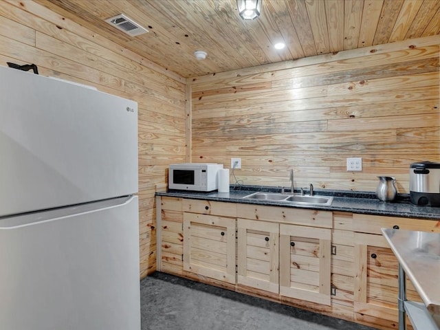 2524 US Highway 69 N, Lufkin, TX 75904 - kitchen with white appliances, a sink, wood walls, dark countertops, and wood ceiling
