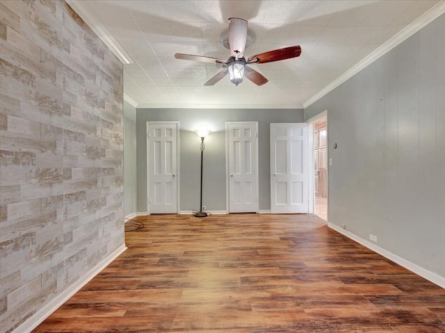 2524 US Highway 69 N, Lufkin, TX 75904 - unfurnished bedroom featuring wood finished floors, ornamental molding, baseboards, and a ceiling fan