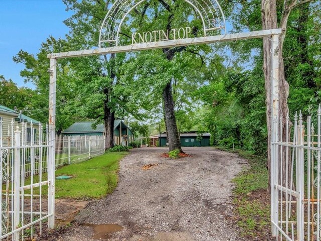 2524 US Highway 69 N, Lufkin, TX 75904 - view of front of home featuring a porch, a ceiling fan, and metal roof