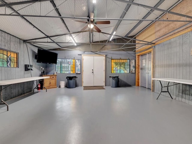 2524 US Highway 69 N, Lufkin, TX 75904 - garage with a ceiling fan and wood walls
