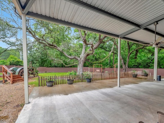 2524 US Highway 69 N, Lufkin, TX 75904 - fenced backyard featuring a patio area and view of wooded area
