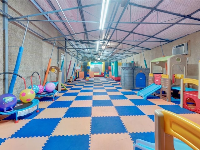 2524 US Highway 69 N, Lufkin, TX 75904 - game room featuring tile patterned floors and a wall mounted air conditioner
