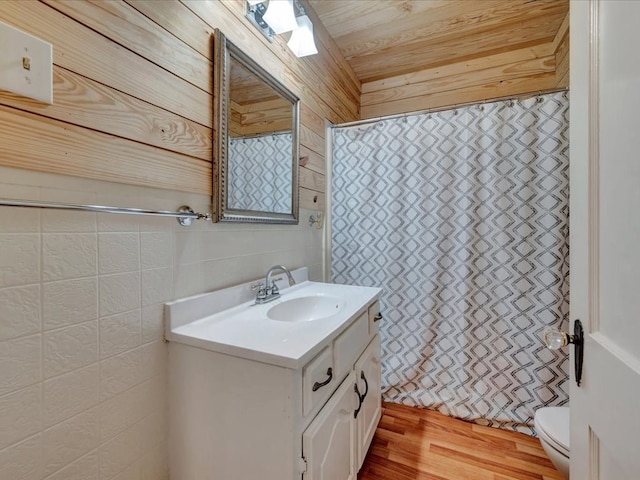 2524 US Highway 69 N, Lufkin, TX 75904 - full bath featuring vanity, toilet, a shower with curtain, and wood finished floors