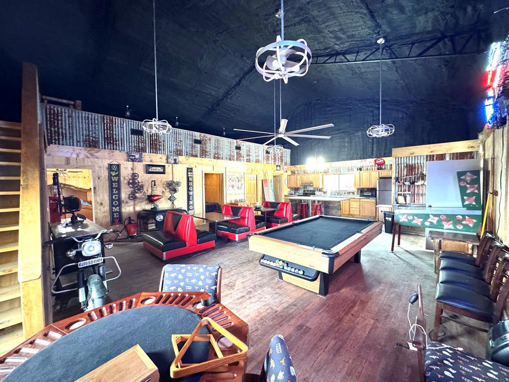 0124 County Road 1490, Center, TX 75935 - playroom featuring high vaulted ceiling, pool table, ceiling fan, and wood finished floors