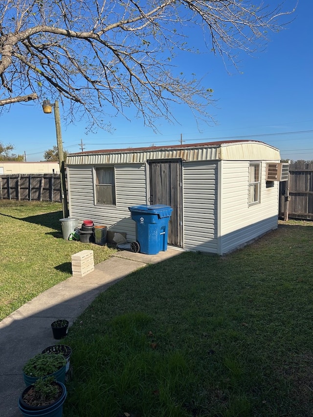 view of outbuilding featuring a yard