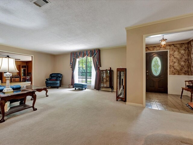 living room with light carpet, crown molding, and a textured ceiling