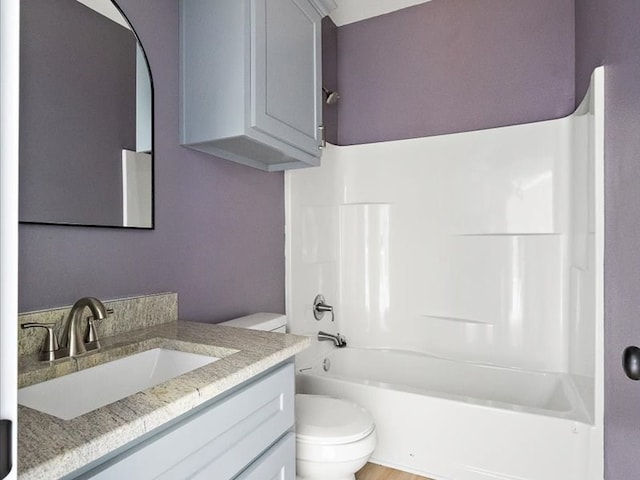 full bathroom featuring vanity, shower / bathing tub combination, and toilet