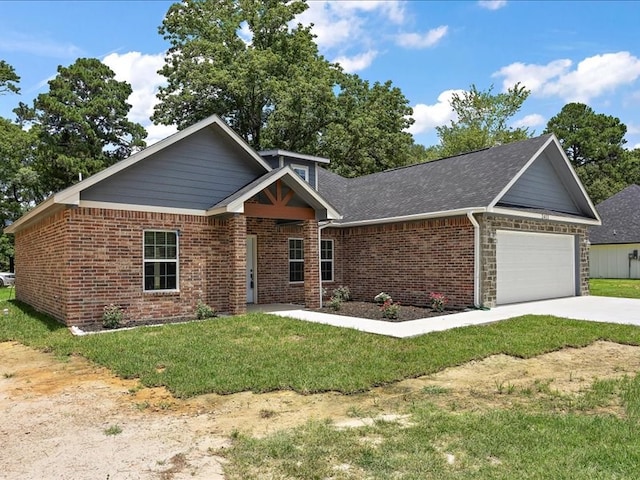 view of front of property with a garage and a front lawn