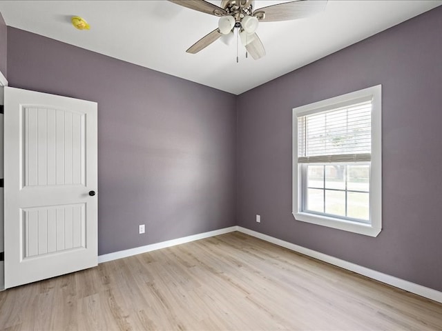 empty room with light wood-type flooring and ceiling fan