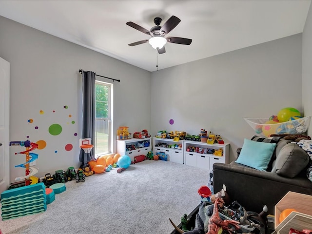 game room with carpet flooring and ceiling fan