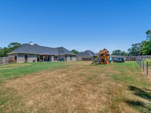 view of yard with a playground