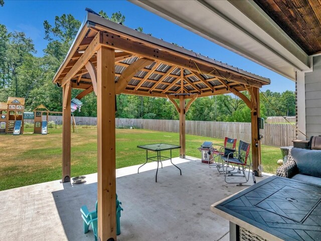 view of patio featuring a playground and a gazebo