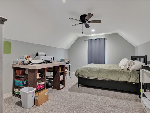 carpeted bedroom with vaulted ceiling and ceiling fan