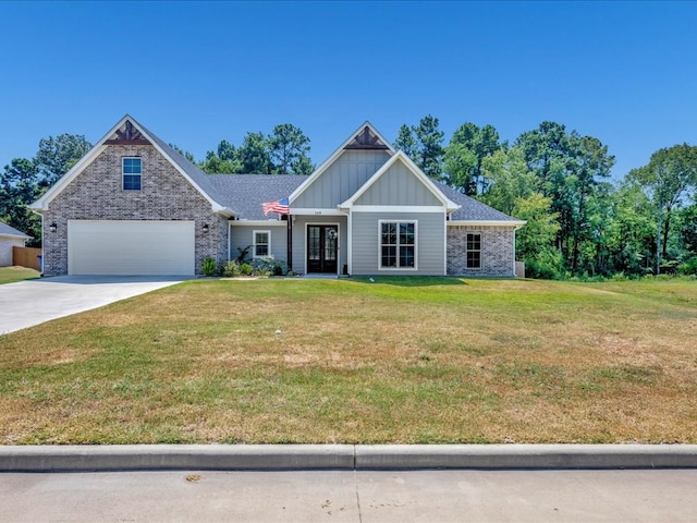 craftsman house with a garage and a front lawn