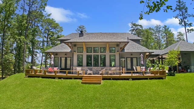 373 Duffer Dr, Brookeland, TX 75931 - back of property featuring a yard, a deck, and roof with shingles