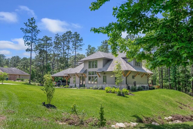 373 Duffer Dr, Brookeland, TX 75931 - view of front of property featuring a front yard and cooling unit