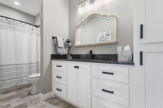 373 Duffer Dr, Brookeland, TX 75931 - full bathroom featuring toilet, vanity, a shower with curtain, and baseboards