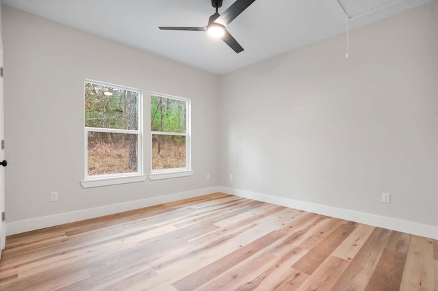 725 Arborcrest Dr, Brookeland, TX 75931 - unfurnished room featuring attic access, baseboards, and light wood-style floors