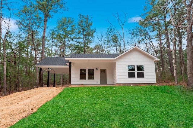 725 Arborcrest Dr, Brookeland, TX 75931 - single story home with driveway, a carport, a front lawn, and roof with shingles