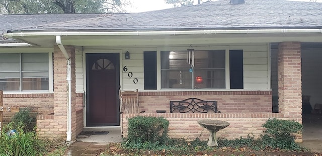 doorway to property with covered porch