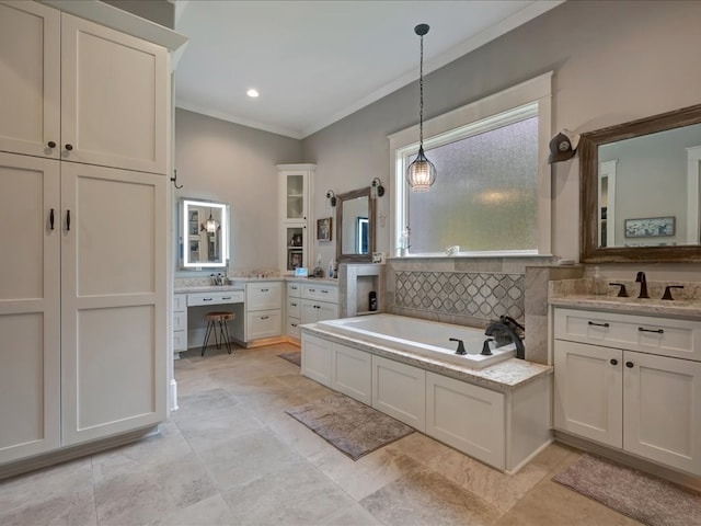 410 Brentwood Dr, Lufkin, TX 75901 - bathroom with crown molding, a garden tub, and two vanities