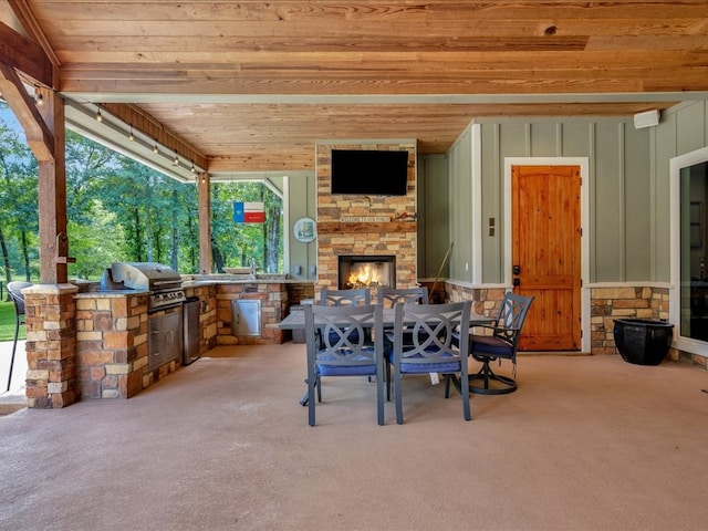 410 Brentwood Dr, Lufkin, TX 75901 - view of patio / terrace featuring an outdoor stone fireplace, an outdoor kitchen, and outdoor dining area