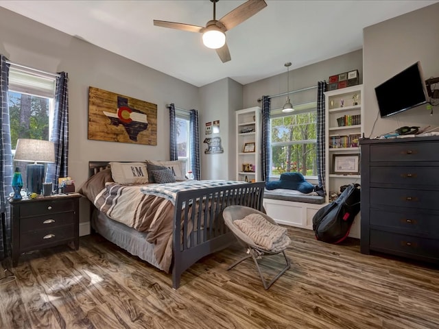 410 Brentwood Dr, Lufkin, TX 75901 - bedroom featuring wood finished floors, multiple windows, and ceiling fan