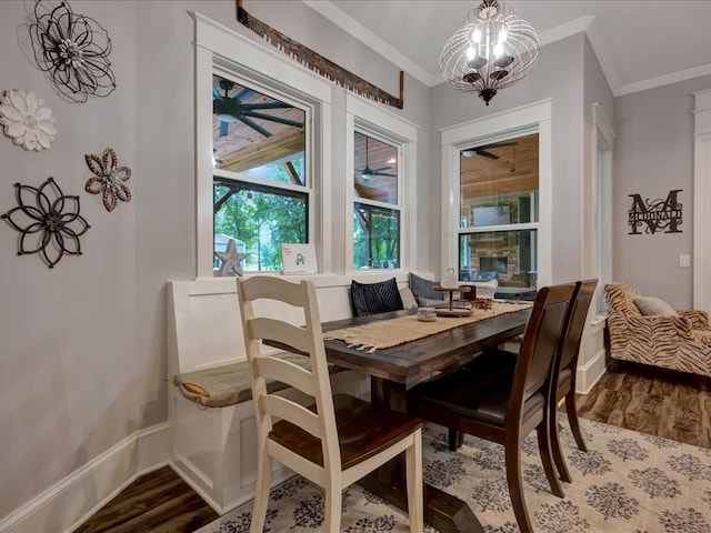410 Brentwood Dr, Lufkin, TX 75901 - dining space with wood finished floors, crown molding, and a chandelier
