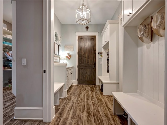 410 Brentwood Dr, Lufkin, TX 75901 - mudroom with dark wood-type flooring and a chandelier