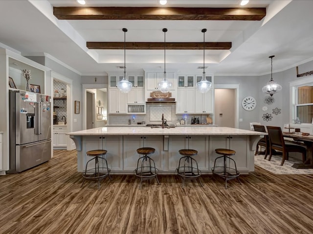 410 Brentwood Dr, Lufkin, TX 75901 - kitchen featuring high end refrigerator, dark wood finished floors, white cabinets, decorative backsplash, and a large island