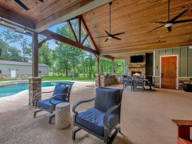 410 Brentwood Dr, Lufkin, TX 75901 - view of patio / terrace featuring a ceiling fan, an outdoor stone fireplace, and an outdoor pool