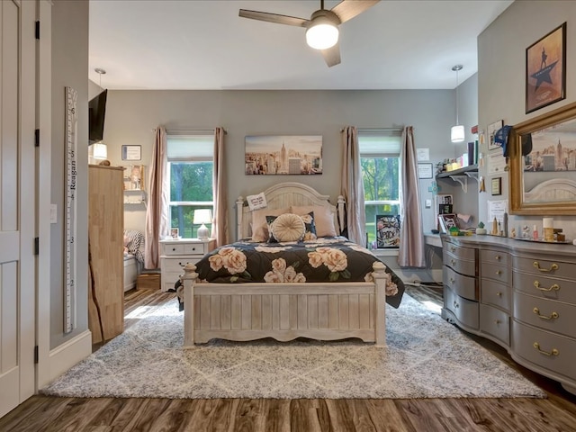 410 Brentwood Dr, Lufkin, TX 75901 - bedroom with multiple windows, wood finished floors, and a ceiling fan