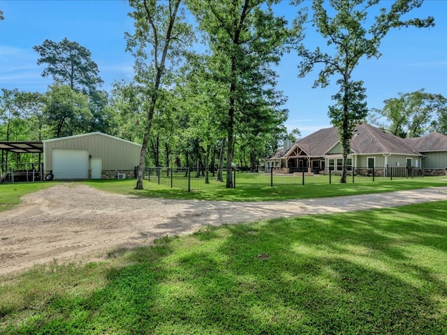 410 Brentwood Dr, Lufkin, TX 75901 - view of property's community featuring driveway, a detached garage, and an outbuilding