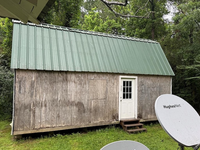 view of outbuilding featuring an outdoor structure and entry steps