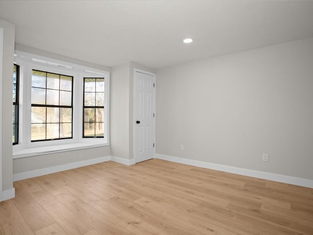 empty room with light hardwood / wood-style floors