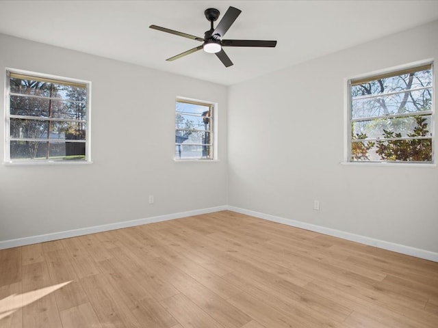 unfurnished room featuring ceiling fan and light hardwood / wood-style floors