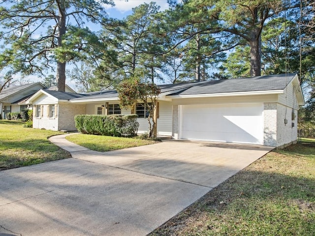 ranch-style house with a garage and a front lawn