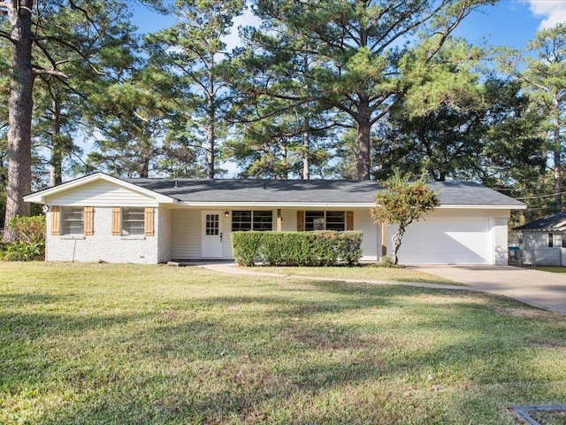 ranch-style house featuring a garage and a front yard