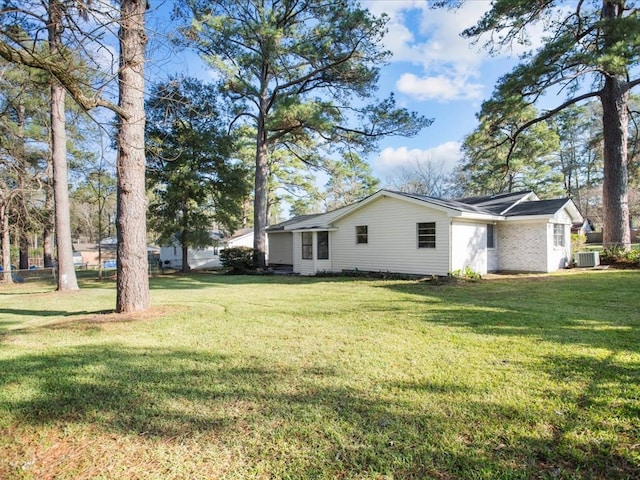 view of yard with central AC