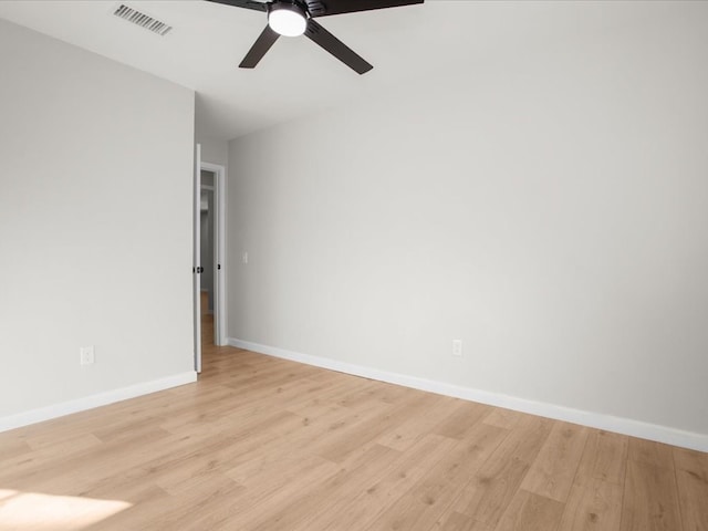 spare room with light hardwood / wood-style flooring and ceiling fan