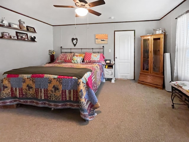220 N Pamela Dr, Brookeland, TX 75931 - bedroom with carpet floors, ornamental molding, and a ceiling fan