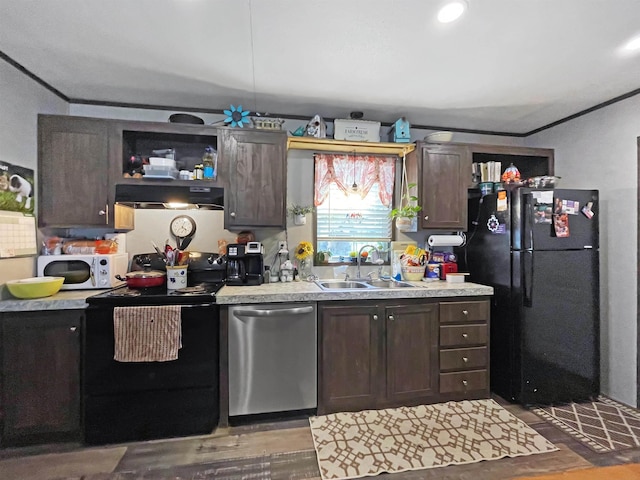 220 N Pamela Dr, Brookeland, TX 75931 - kitchen with black appliances, dark brown cabinetry, light countertops, and wood finished floors