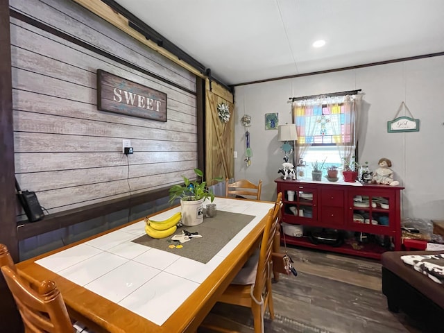 220 N Pamela Dr, Brookeland, TX 75931 - dining space featuring wood finished floors, wood walls, and recessed lighting